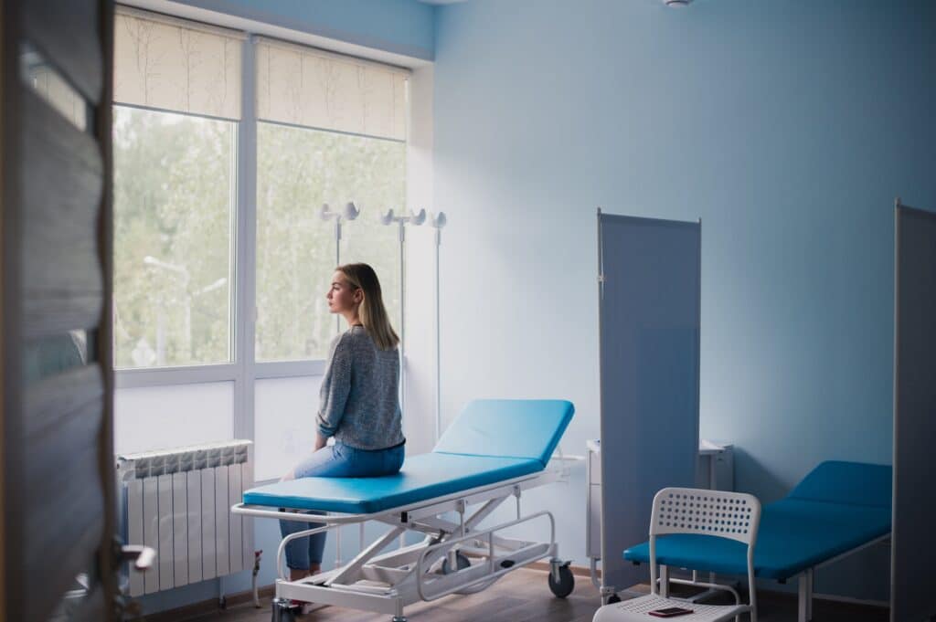 Woman waiting for doctor in hospital